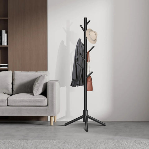Freestanding Coat Rack With 8 Hooks And 3 Adjustable Heights in living room, holding hat, coat, and bag, black finish.