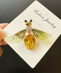 Vintage Crystal Bee Brooch For Women Featuring Amber And Clear Rhinestone Bumblebee Wings on display with dainty insect design.