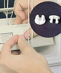 Top Shelf White Bottom Rail Cord Cover Buttons For Horizontal Blinds Repair being installed on window blinds.