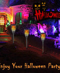 Sun Powered Solar Torch Lights With Realistic Flickering Flame Effect illuminating a Halloween-themed garden pathway, 43 inches tall, waterproof, dusk to dawn auto on off, perfect for yard paths and patio, 2 pack.