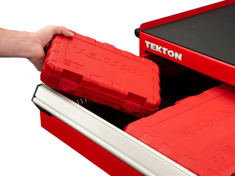 Person placing a red sturdy case for 3/8 Inch Drive Deep Six Point Impact Socket Set, 19 Piece Metric Range from 6 to 24 mm in drawer.