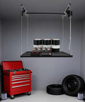 Hardcore Adjustable Overhead Garage Storage Rack With 300 Pound Capacity Rustproof Carbon Steel Ceiling Mount Hanger holding tools and gear.