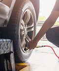 Garage Ready Dual Head Air Chuck Set With Closed Flow One Quarter Inch NPT Heavy Duty Tire Inflation Kit in use on car tire
