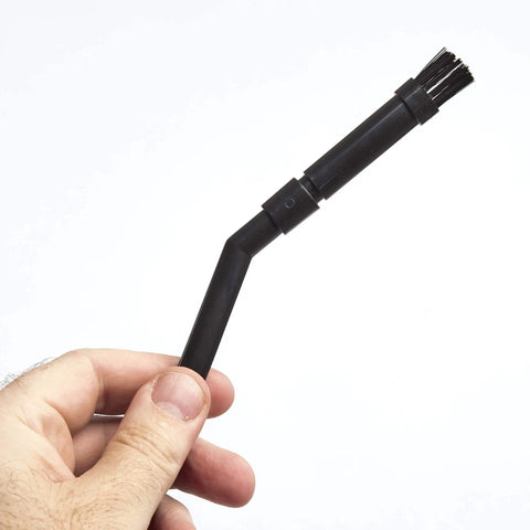 Person holding angled wet dry vacuum attachment from Wet Dry Vacuum Attachment Kit For Compact Wet Dry Vacuum Cleaners One And One Quarter Inch Micro Cleaning Set Pro Grade With Blowing Nozzle Straight And Angled Extension Wands Round And Oblong Dusting Brushes Crevice Tool For Precision Cleaning.
