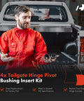 Mechanic holding Tailgate Hinge Pivot Bushing Insert Kit for Ford F Series and Dodge Ram Trucks near a pickup truck bed