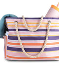 Colorful striped beach tote with rope handles and items inside, not showing Extra Large Waterproof Sandproof Beach Tote For Women With Zipper Pocket Pink Solid Color Bag For Travel Poolside Outings Summer Vacations And Outdoor Family Days.