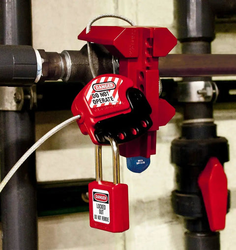Red Lockout Tagout Safety Padlock with Key for Electrical Work Non Conductive Thermoplastic Body Durable Metal Shackle OSHA Compliant Lockout Tool 410RED securely attached to industrial pipe for safety.