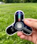 Close-up of Beginner-Friendly Soldering Practice Kit With 3 Leaves Fidget Spinner Project LED Flasher Light DIY Electronics Board STEM Kit in hand outside.