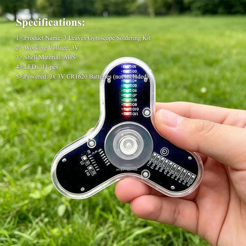 Close-up of Beginner-Friendly Soldering Practice Kit With 3 Leaves Fidget Spinner Project LED Flasher Light DIY Electronics Board STEM Kit in hand outside.
