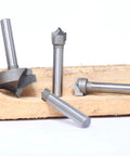 Four Piece One Quarter Inch Shank Roundover Plunge Router Bit Set With Three Eighths, Half And One Inch Cutting Diameters And Radii Of Three Sixteenths, One Quarter And One Half Inch For Wood Engraving, Sign Making, Relief Carving, 2D And 3D Carving displayed on wood surface.