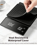 Espresso Scale With Timer For Home Baristas, 3Kg Capacity, shows heat resistant cover being lifted from digital platform.