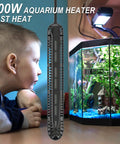 Revamp Your Tank With This No Drama 300W Submersible Aquarium Heater Engineered For 40 To 75 Gallon Freshwater And Saltwater Systems Offering Rock Solid Temperature Control next to a child observing an aquarium.