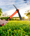 Single Head Sharp Hoe With 16 Inch Wooden Handle Forged Steel Garden Hoe For Weeding Digging And Loosening Soil Built Tough Durable Construction With Non Slip Rubber Grip in use against a grassy background.