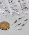 96 Pcs 3x8mm DIP Quartz Crystal Oscillators Kit with coin for size comparison, shown in compartment box