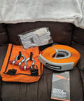 Weekender Offroad Recovery Kit With Snatch Strap 17500 Lb Two 4.75 Ton D Ring Shackles Premium Leather Recovery Gloves Hi Vis Orange Organizer Bag Get You Unstuck Vehicle Rescue Gear For 4x4 Adventures shown in original packaging on sofa