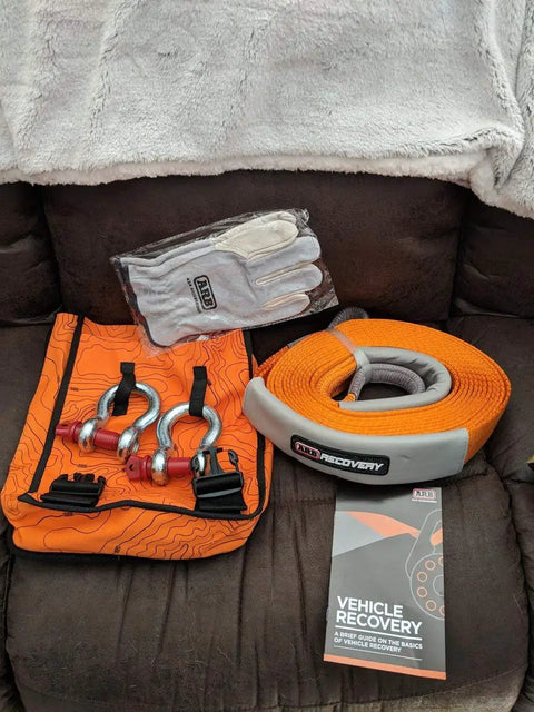 Weekender Offroad Recovery Kit With Snatch Strap 17500 Lb Two 4.75 Ton D Ring Shackles Premium Leather Recovery Gloves Hi Vis Orange Organizer Bag Get You Unstuck Vehicle Rescue Gear For 4x4 Adventures shown in original packaging on sofa