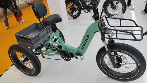Green tricycle with storage basket, featuring 20 Inch Fat Bike Fork With 4.0 Inch Tire Spread Suspension, Dual Locking Modes.