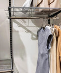 Black Twin Rail Wall Shelving System With Adjustable Twenty Five Inch Shelves And Eleven Point Five Inch Brackets Heavy Duty No Fuss DIY Ready Storage Rack For Kitchen Closet And Home Indoor Includes Rails Brackets And Screws Easy Install shown installed with clothing and accessories.