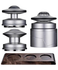 Straight Up Pro Grade 58Mm Espresso Accessories Kit with two silver tools and a wooden stand for precision brewing.