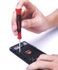 Using a Nine Piece Precision Screwdriver Set With Magnetic Tips And Swivel End Cap on a smartphone battery