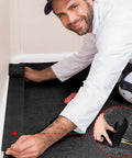 Man installing Carpet Cord Cover And Cable Protector Floor Cover For Office Use 19.69 Ft Long Black Easy Hook And Loop Cable Management