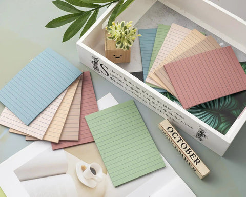 12 Pack Lined Sticky Notes 4x6 Inches With Ruled Sheets, Ultra Sticky Memo Pads in Vintage Colors on a desk.