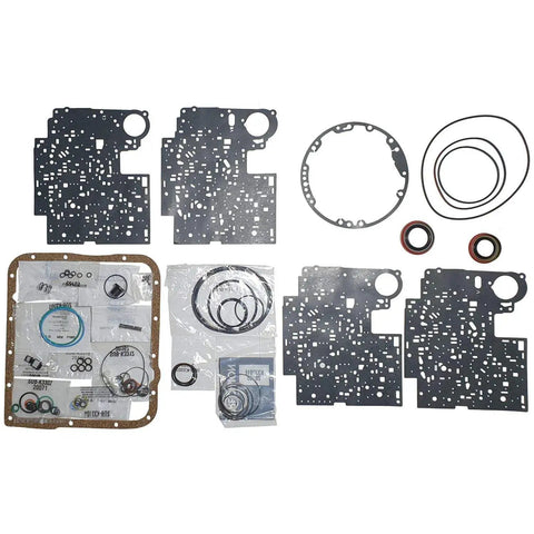 4L60E Transmission Kit 1997 To 2003 With High Energy Clutches, Band, Piston Kit, Bushing And Filter set laid out on surface
