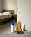 Advanced Wall Restoration Paste and Patch Kit for Indoor Walls, tools, and cracked wall in a bedroom setting