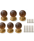 The Real Deal Natural Walnut And Antique Brass Cabinet Knobs Six Pack Hella Sturdy Round Ball Handles For Kitchen Drawers. Group photo of six walnut knobs with brass mounts.