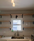 Built Tough 5.5 Inch Black Shelf Brackets With Lip For Floating Shelves installed in kitchen with subway tiles