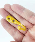Built Tough Wall Mounted Hooks Set Of Four Premium Zinc Alloy Coat Hangers Bright Yellow for storage, showing one hook in hand.