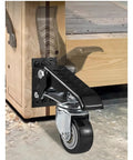 Set Of Four 2.5 Inch Retractable Swivel Workbench Casters With 360 Degree Spin Stepdown Lift Mode attached to workbench leg.