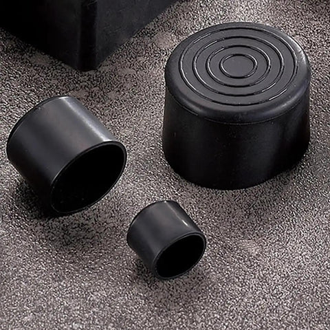 Heavy Gauge Round Rubber Chair Leg Caps And Table Foot Floor Protectors One Inch Black bumpy covers in various sizes on a surface.