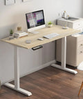 Rockin Adjustable Standing Computer Desk For Modern Home Office Or Study With Smart Height Control T-Shaped Frame Ergonomic Desktop Laptop Table 1 Point 4 Meters in light wood finish.