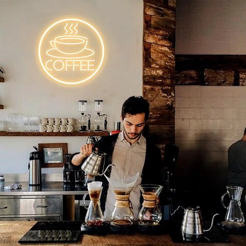 Coffee Cup Neon Sign USB Powered LED Light With 3D Engraved Art in cafe setting above barista with coffee equipment.