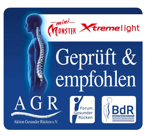 Image of a spine illustration on a product label for mini Monster Xtreme light, promoting back health.