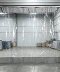Heavy Duty Thermal Insulated Garage Divider Curtain With No Sweat Setup Track Durable Pvc Partition Barrier For Warehouses That Blocks Dust And Paint Mist Real Tight in a warehouse setting, showcasing clear PVC.
