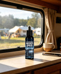 Frosted Glass Spray 30ml Anti-Glare Translucent Portable Agent on a campervan table with RV window view.