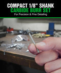 Close-up of a tungsten carbide burr bit with a 1/8 in shank, double-cut, held between fingers.