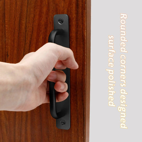 Hand holding 2 Pack Aluminum Sliding Barn Door Handles 7.1 Inch Long 160mm Center To Center Hole Spacing Black Closet Kitchen Cabinet Bathroom Pulls With Plate And Screws mounted on door