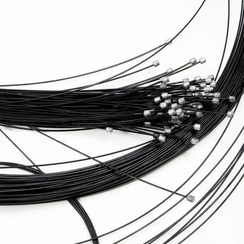 Close-up of Teflon Shift Cable Inner Derailleur Cables for mountain bike, road bike, BMX, showing 2100mm length and metal end caps.