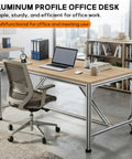 Badass Rock Solid Heavy Duty Aluminum Work Table With Thick Wood Top And Tough Utility Workbench For Garage Workshop Kitchen Prep And Commercial Packing Rack in modern office setup with laptop.