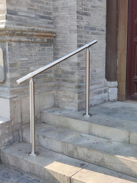 Hella Sturdy 3 Step Outdoor Handrail With Zero Sweat Diy Install Pack And Rugged 304 Stainless Steel Build For Porch Stairs On Concrete Brick Or Wood Planks Silver Finish Smooth Ride installed on outdoor stone steps.