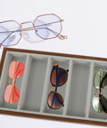 Rustic Walnut Wood Seven Grid Sunglasses Storage Tray With Cozy Gray Velvet Padding displaying various sunglasses.