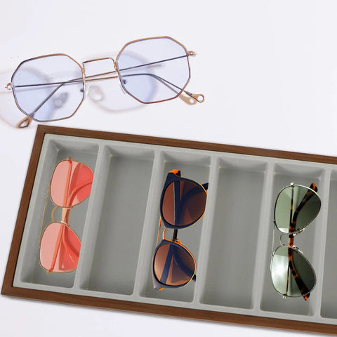 Rustic Walnut Wood Seven Grid Sunglasses Storage Tray With Cozy Gray Velvet Padding displaying various sunglasses.