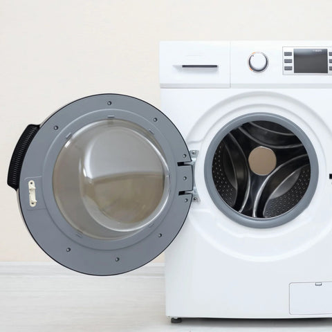 Front-loading washer with open door; gray door frame and visible stainless drum.
