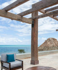 Outdoor pergola overlooking ocean view with wooden beams secured by 4 Piece Joist Anchor Connectors For 4x4 And 4x6 Wood Posts Heavy Duty Carbon Steel Mounting Brackets For Roofing Trusses To Beams Outdoor Pergola And Deck Support Rust Resistant Weatherproof Construction.