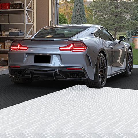 Car on interlocking garage floor tiles 12 inch square 25 pack graphite grey non slip diamond plate covering for basements and gyms