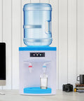 Hot And Cold Water Desktop Dispenser For 1.3 To 5 Gallon Jugs Top Loading Countertop Cooler with glass filling with water