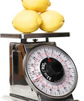 Analog 2lb Kitchen Scale With Mechanical Dial Stainless Steel Platform Rugged Pro Grade Build with lemons on top